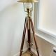 Vintage wooden and brass tripod lamp in marine style.