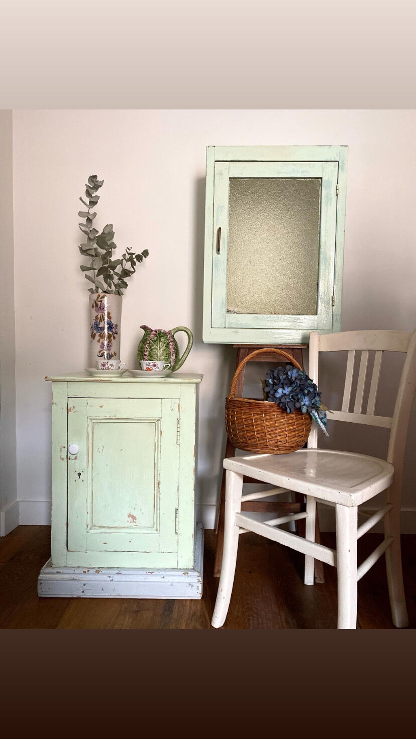 Old medicine cabinet in mint green patinated wood
