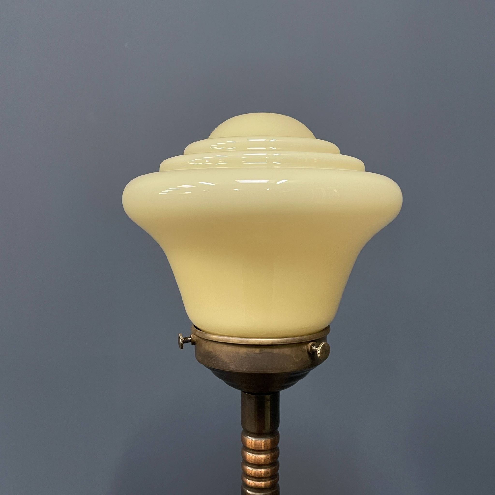 Standing copper table lamp with glass shade