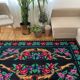 Vintage Romanian wool carpet floral design on black background 235x150cm