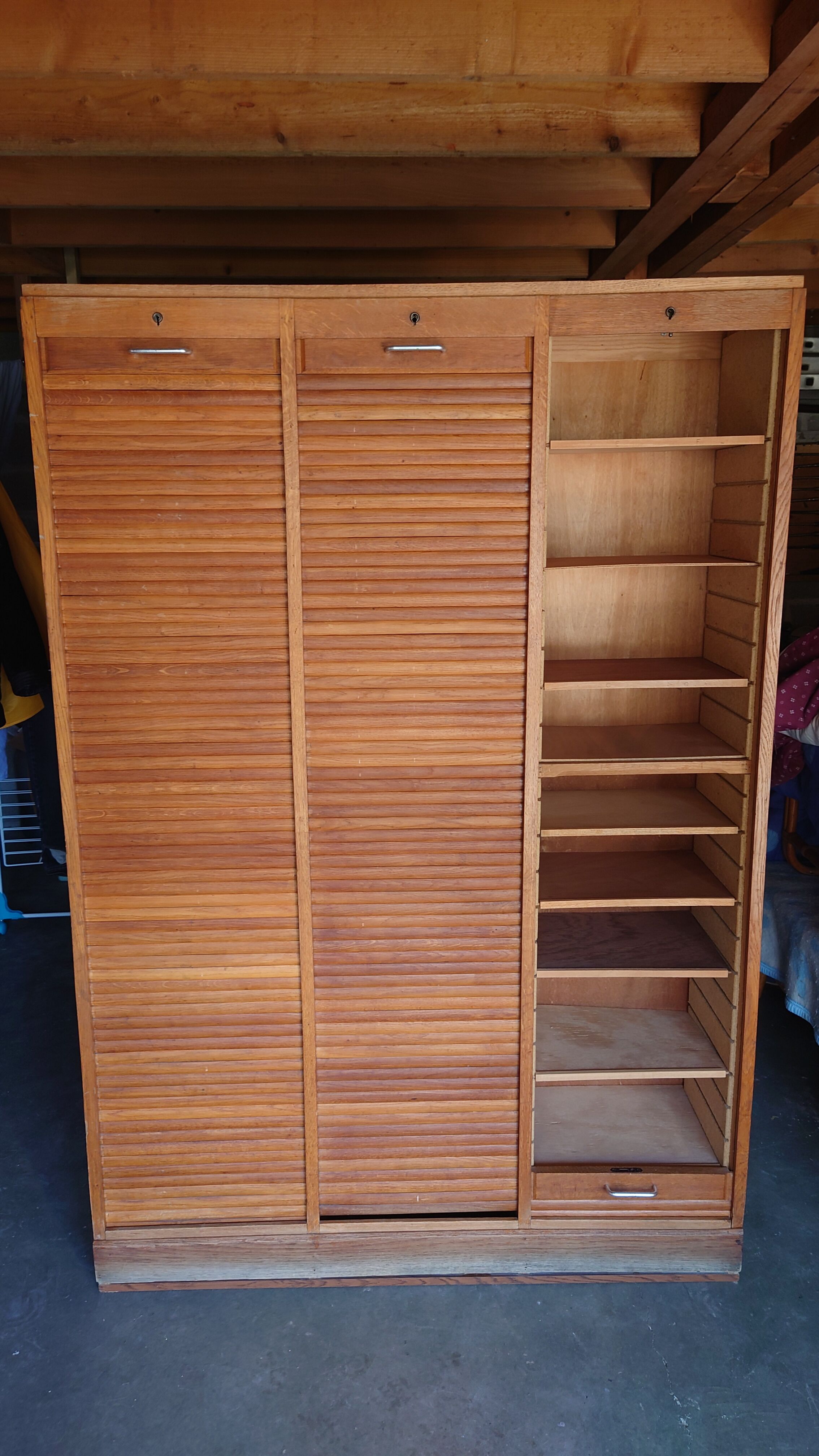 Filing cabinet has curtains, notary furniture. 3 columns