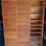 Filing cabinet has curtains, notary furniture. 3 columns