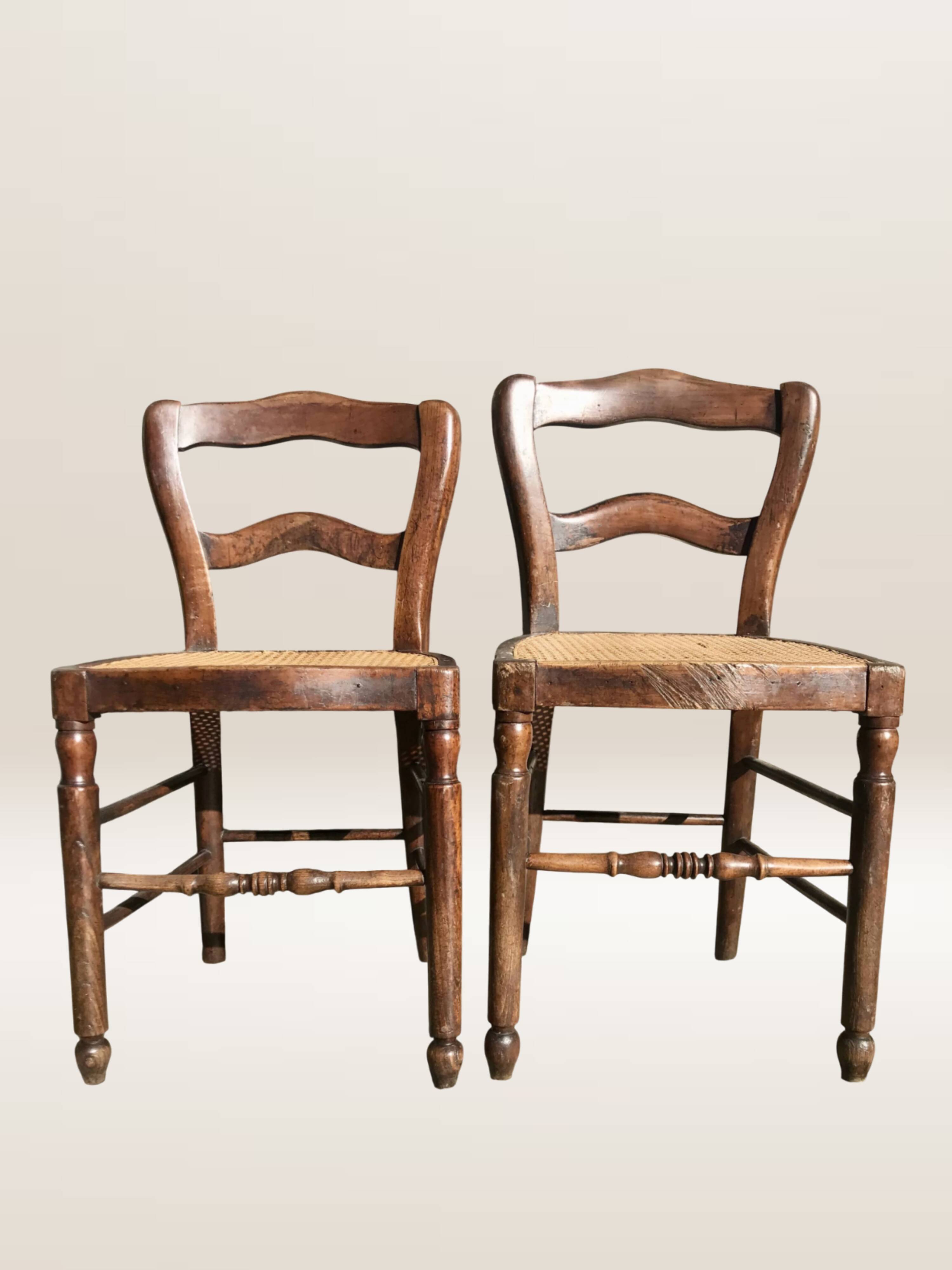 Pair of turned wooden chairs with caning