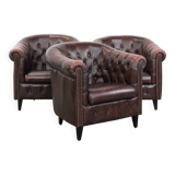 Set of three classic English-style Chesterfield cowhide  club armchairs