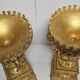 Rare pair of carved and gilded wooden vases, with a refined style inspired by the Empire.
