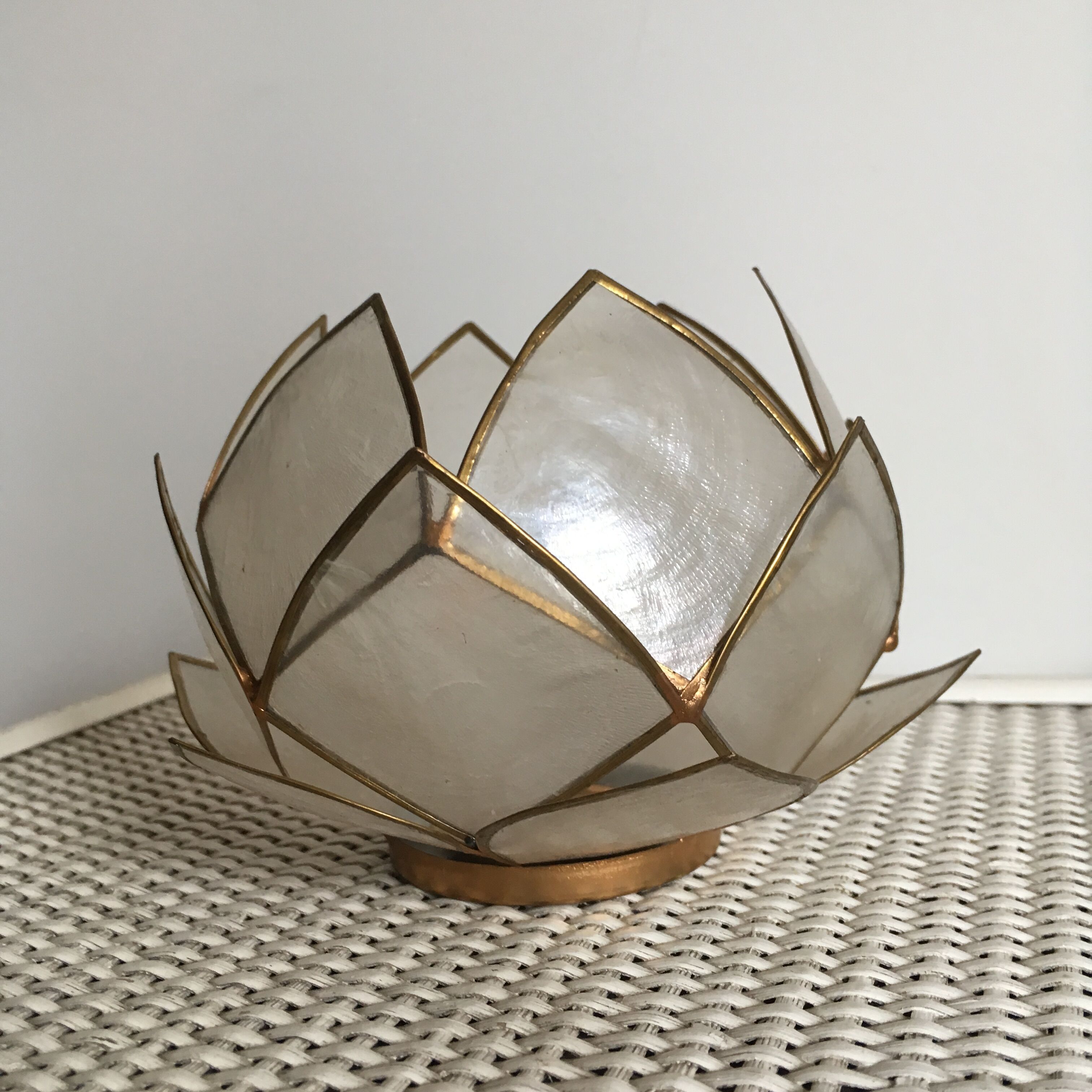 Candlestick or candle holder in nacre flower shape