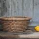 Old wicker basket, straw and bramble, woven basket, countryside.