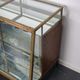 Counter or shop window in oak glass and brass France around 1920