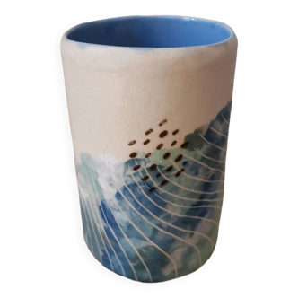 Handcrafted ceramic cup in blue pastels