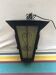 Old black forged iron suspension vintage in moulded glass
