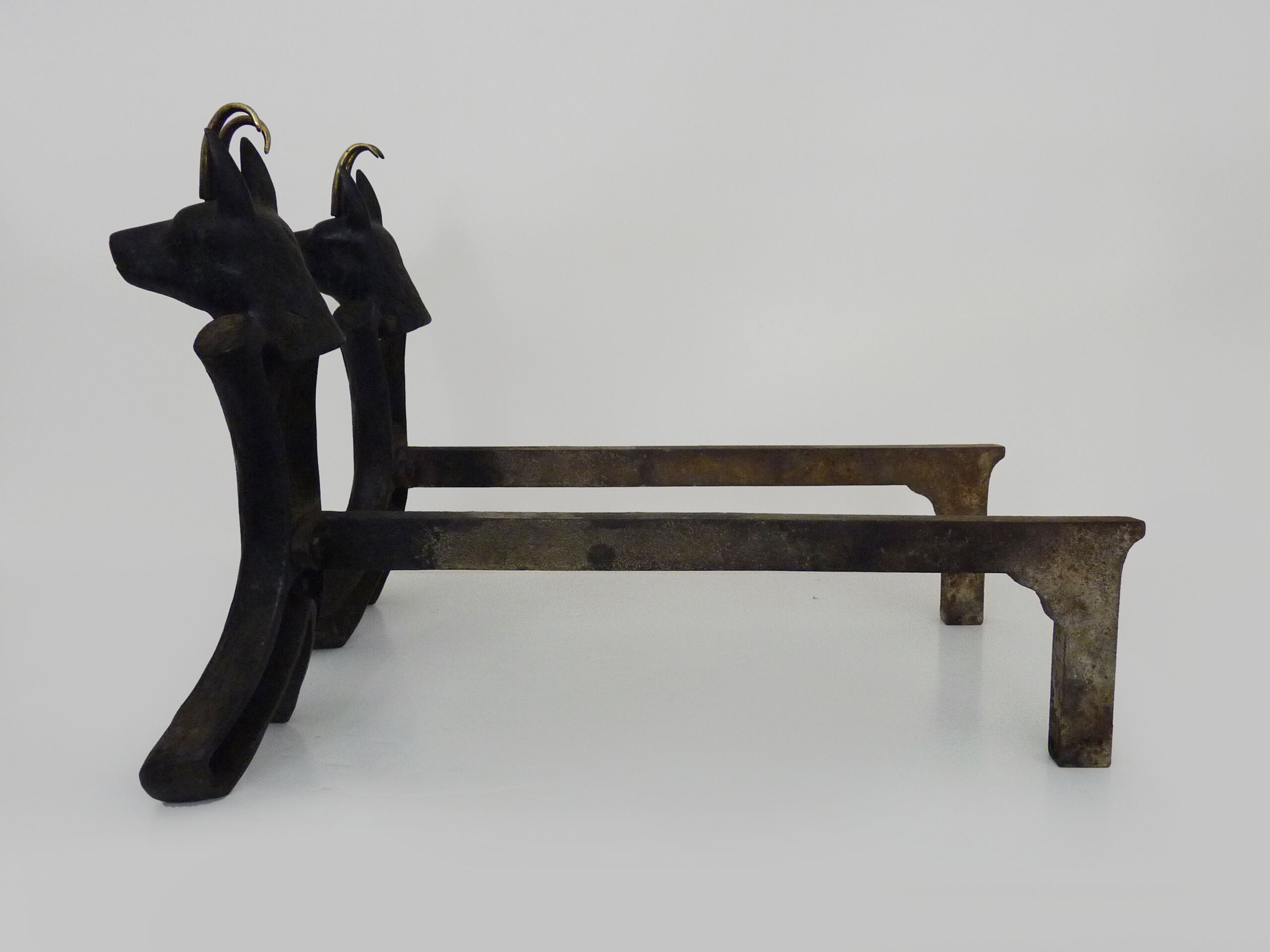 Pair of zoomorphic cast iron chimney pegs representing Isards. 50s