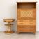 Vintage secretary ensemble and wooden and rattan side table