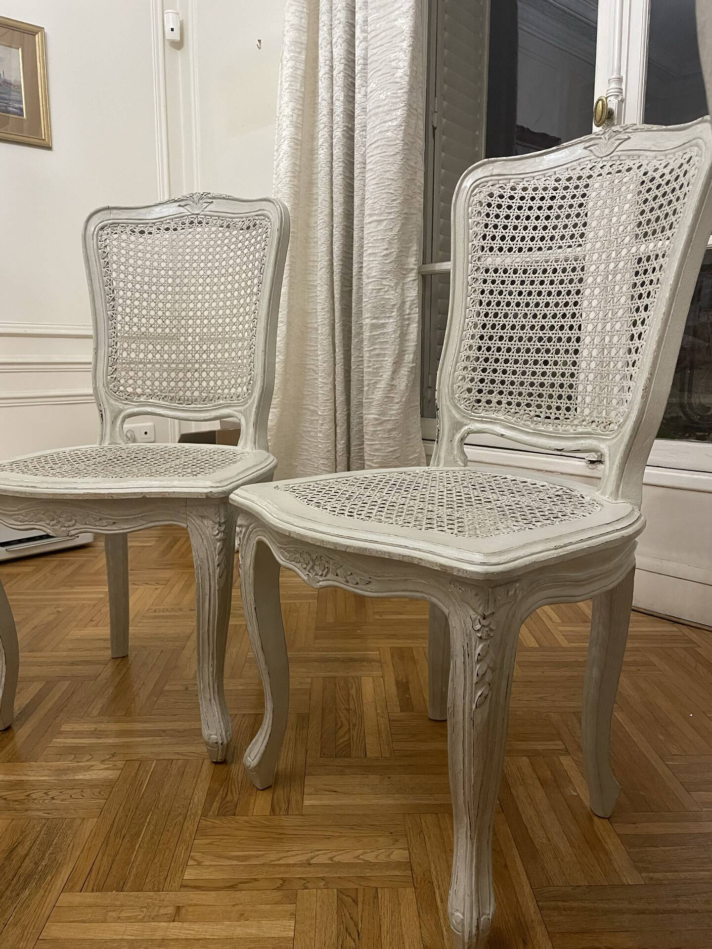 Set of 4 white caned chairs in Louis XV style.