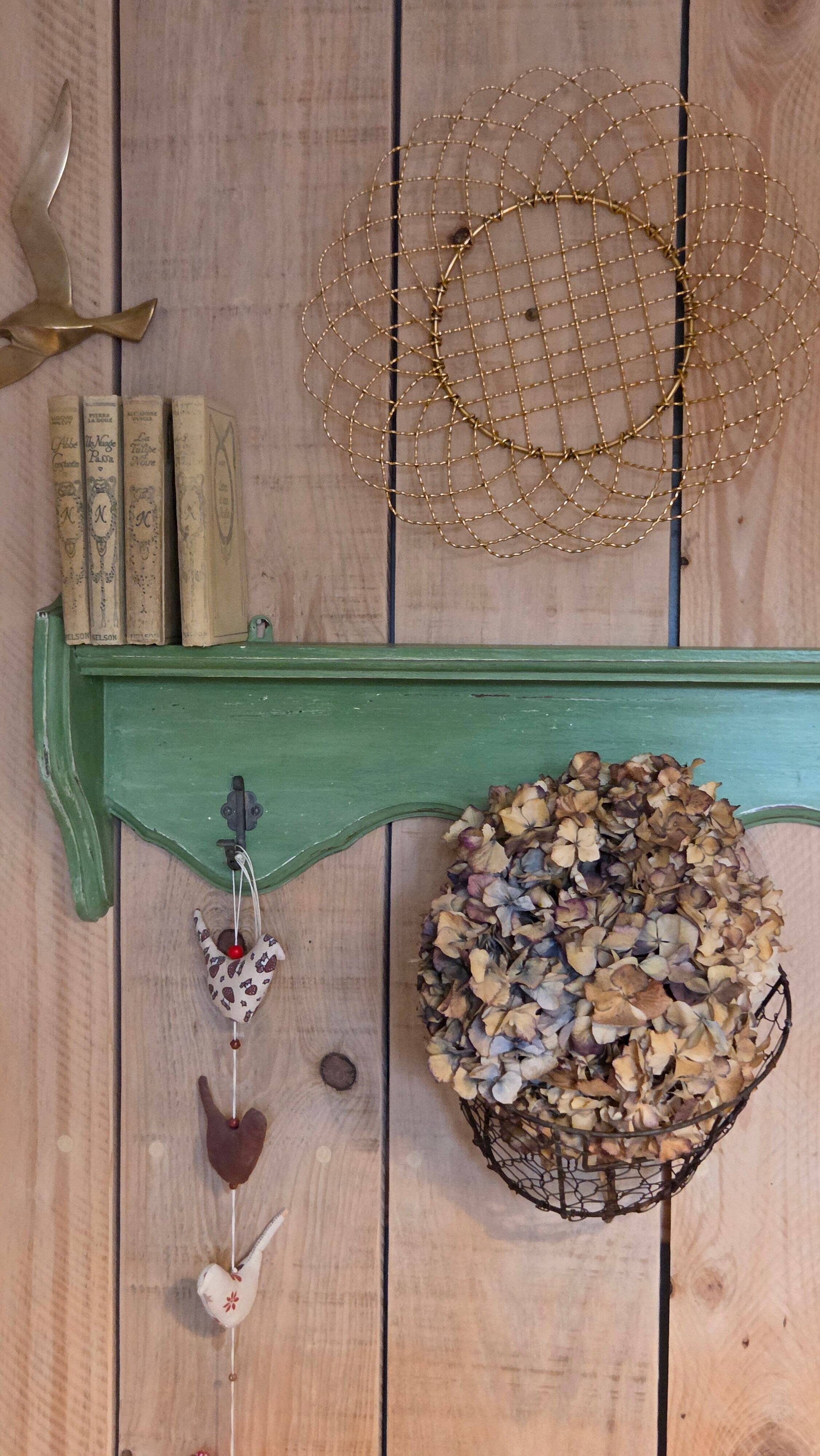 Antique wall shelf with a green patina