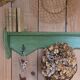 Antique wall shelf with a green patina