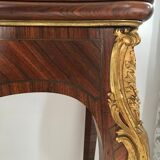 Console transforming into a 19th century Louis XV style gaming table