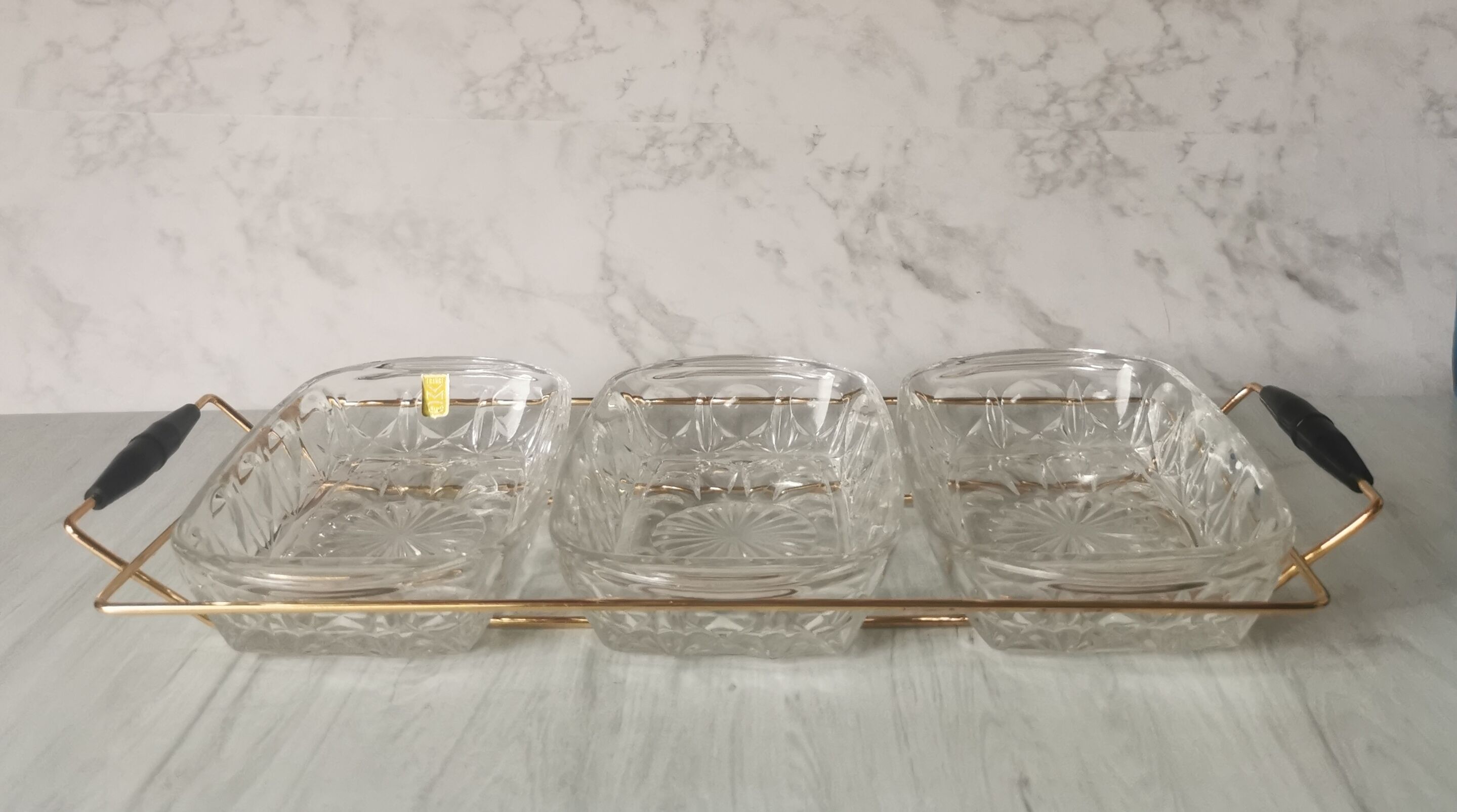 Tray with glass and gold metal compartments