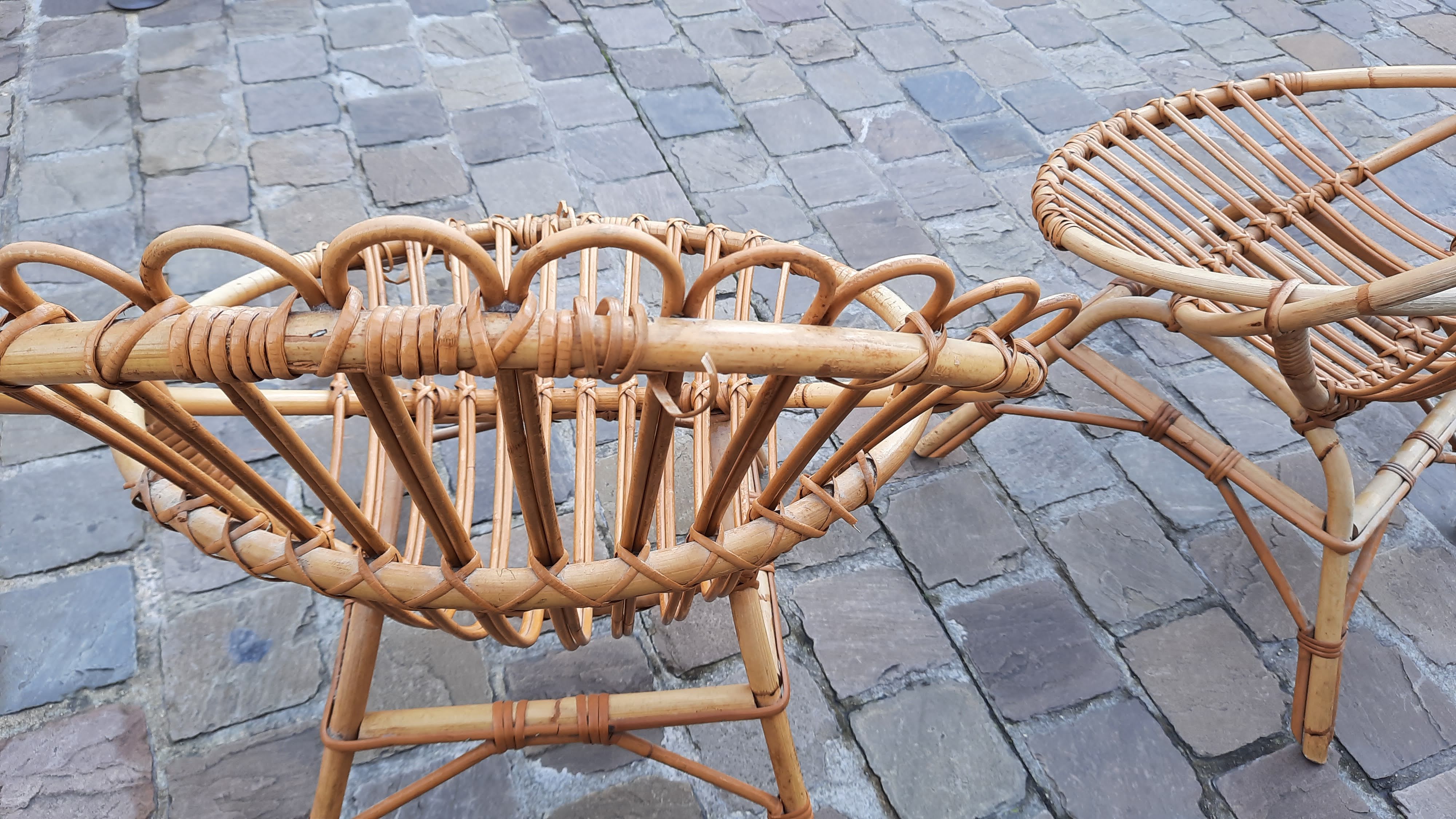Pairs of shell rattan armchairs from the 50