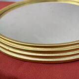 Round mirror in gold metal