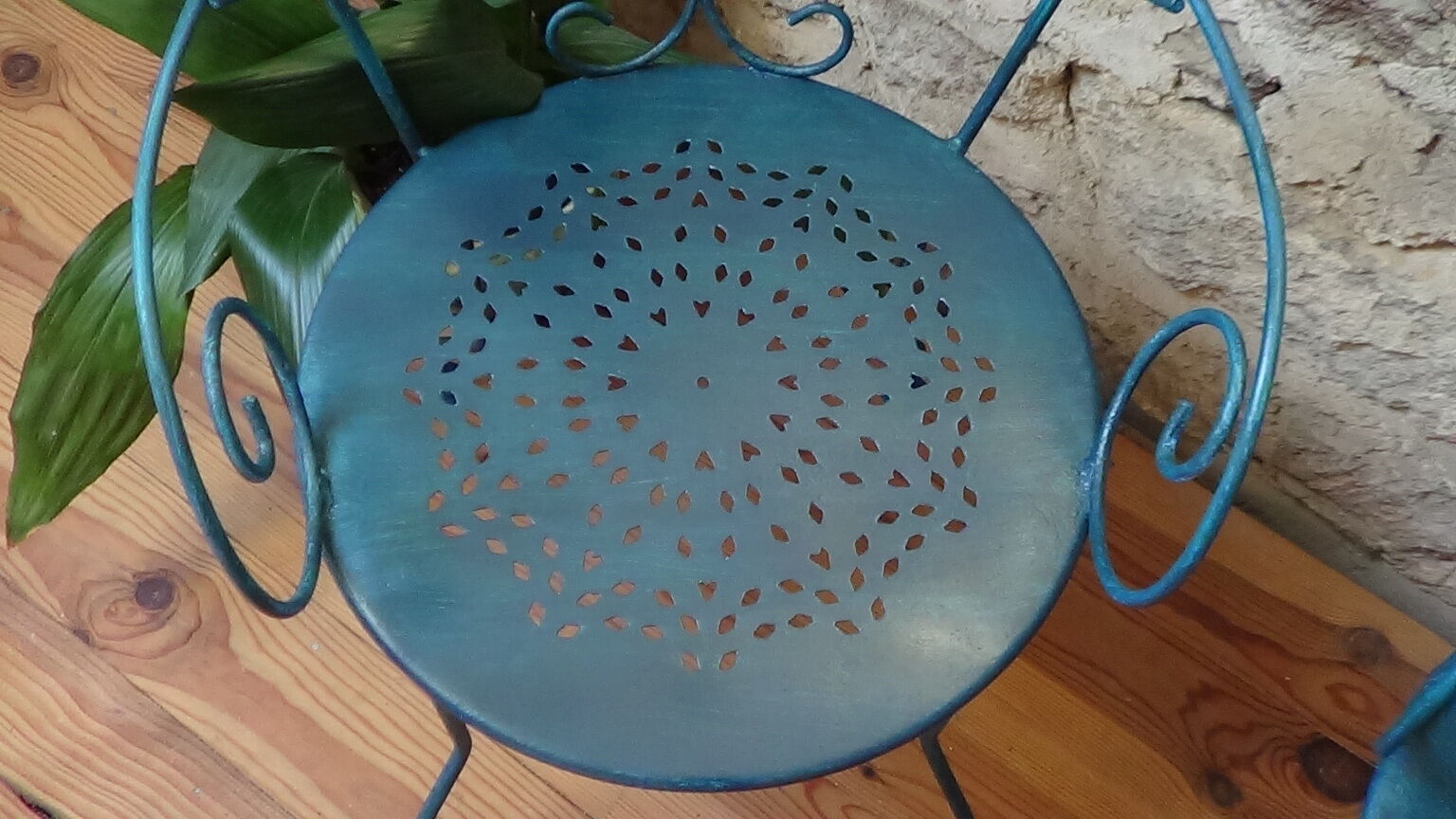 A pair of metal garden chairs