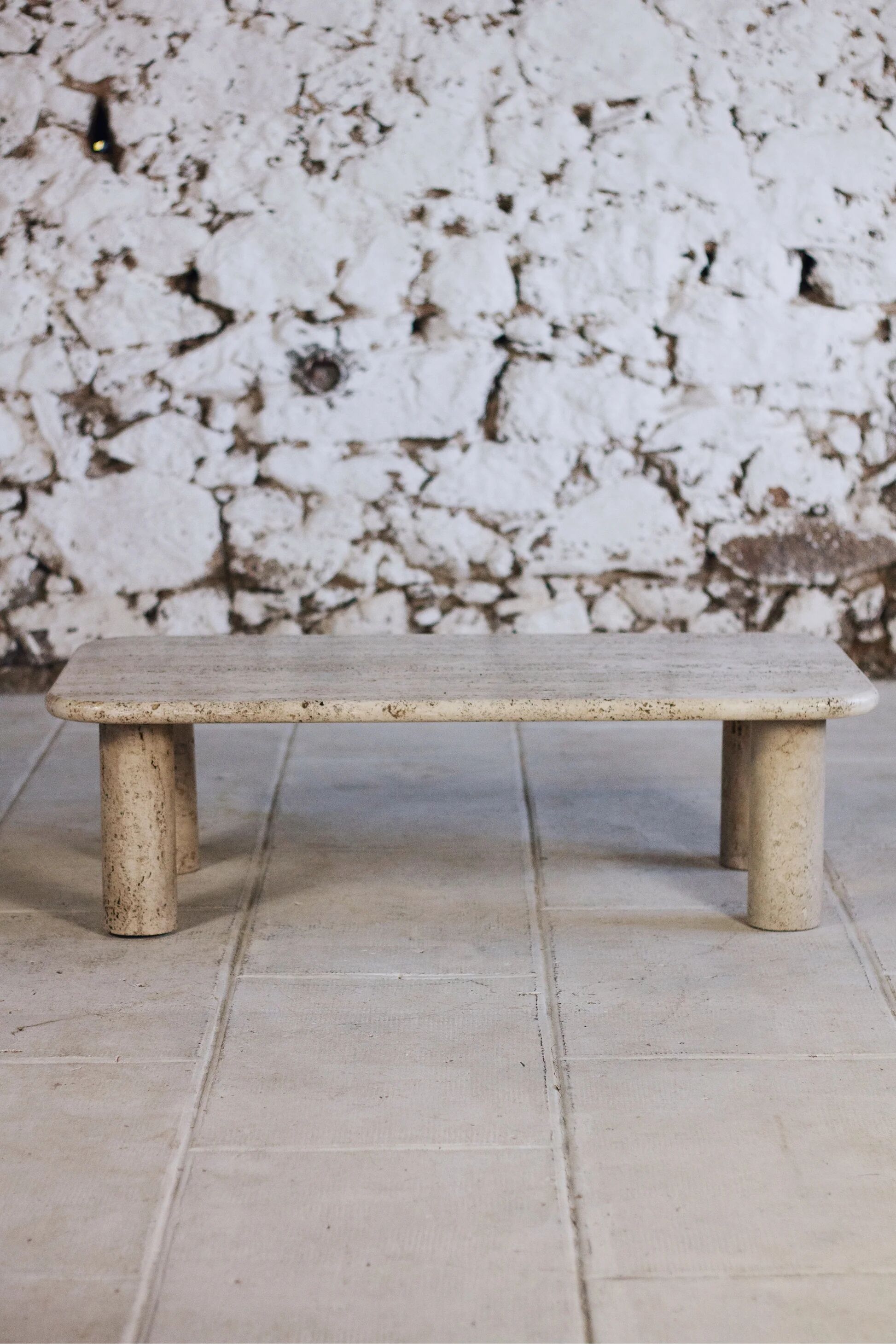 Travertine coffee table in the style of Angelo Mangiarotti, 1970.