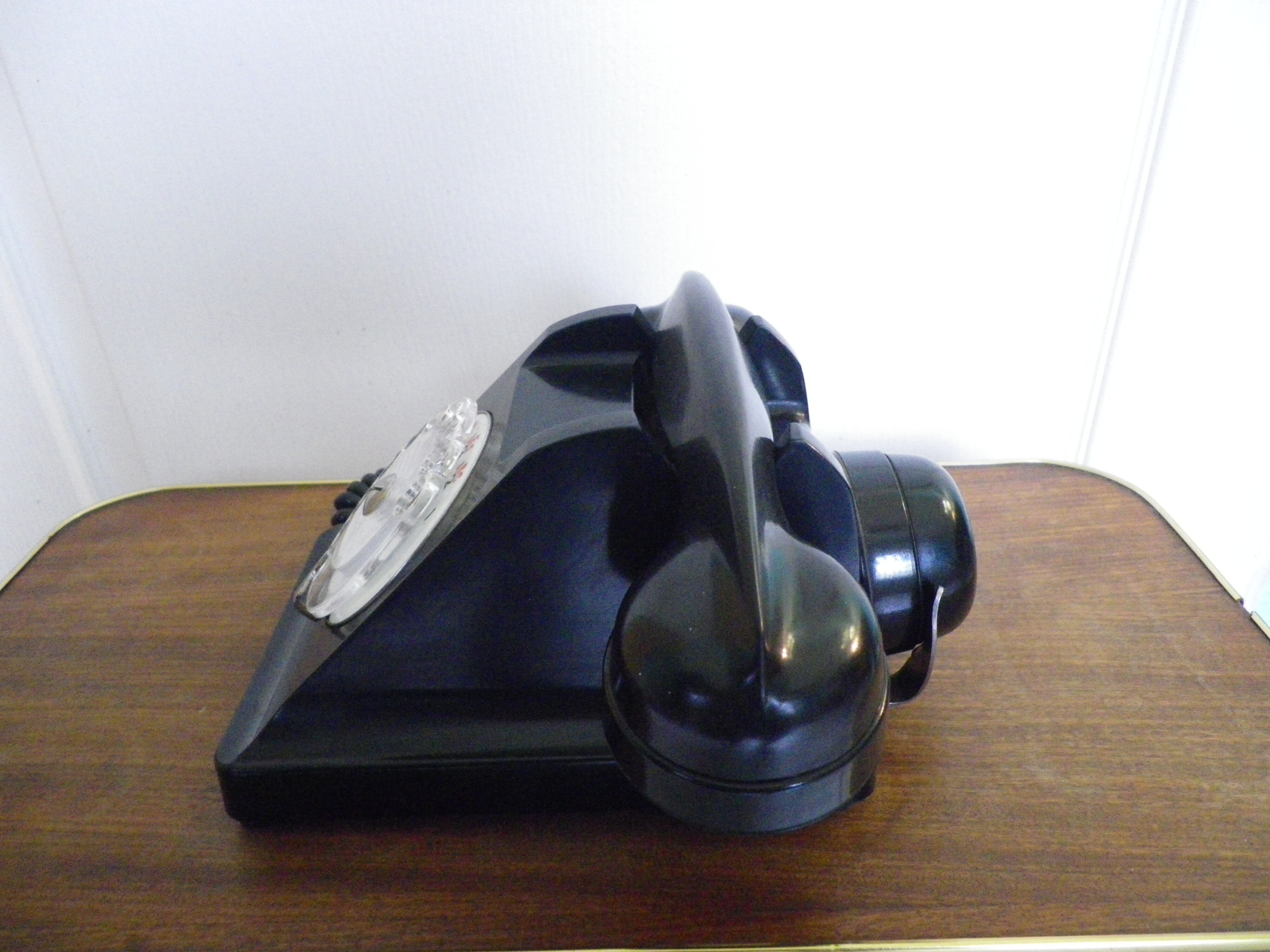 Black bakelite phone with earphone