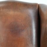 Vintage wingback armchair made of sheepskin leather with beautiful colours