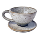 Handcrafted stoneware cup and its saucer – Speckled glaze