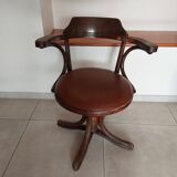 Thonet armchair, swivel, in wood and faux leather.