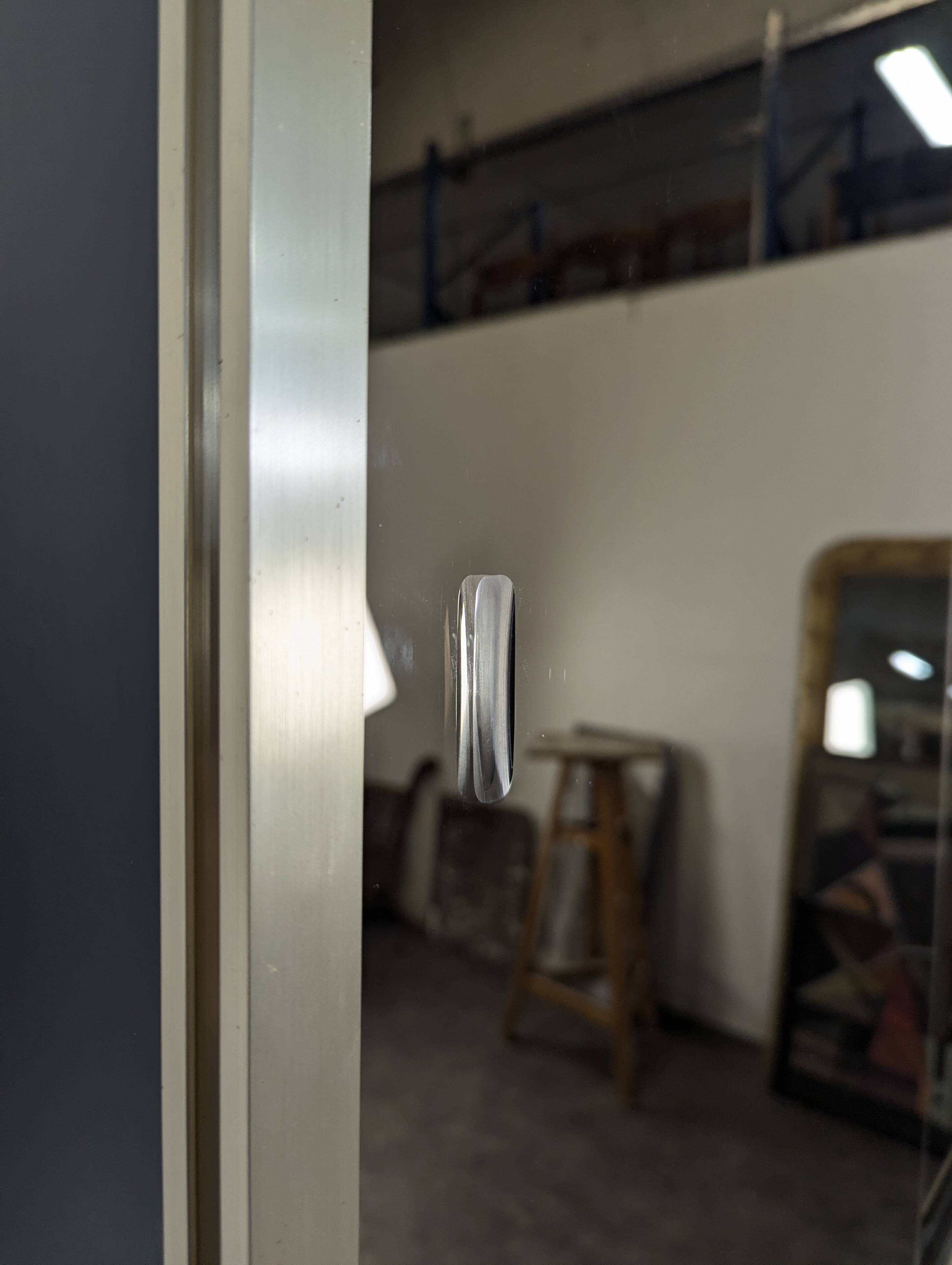 Vintage aluminium and glass display cabinet from the 1980s.