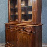 Buffet deux corps époque Napoléon III en bois massif.