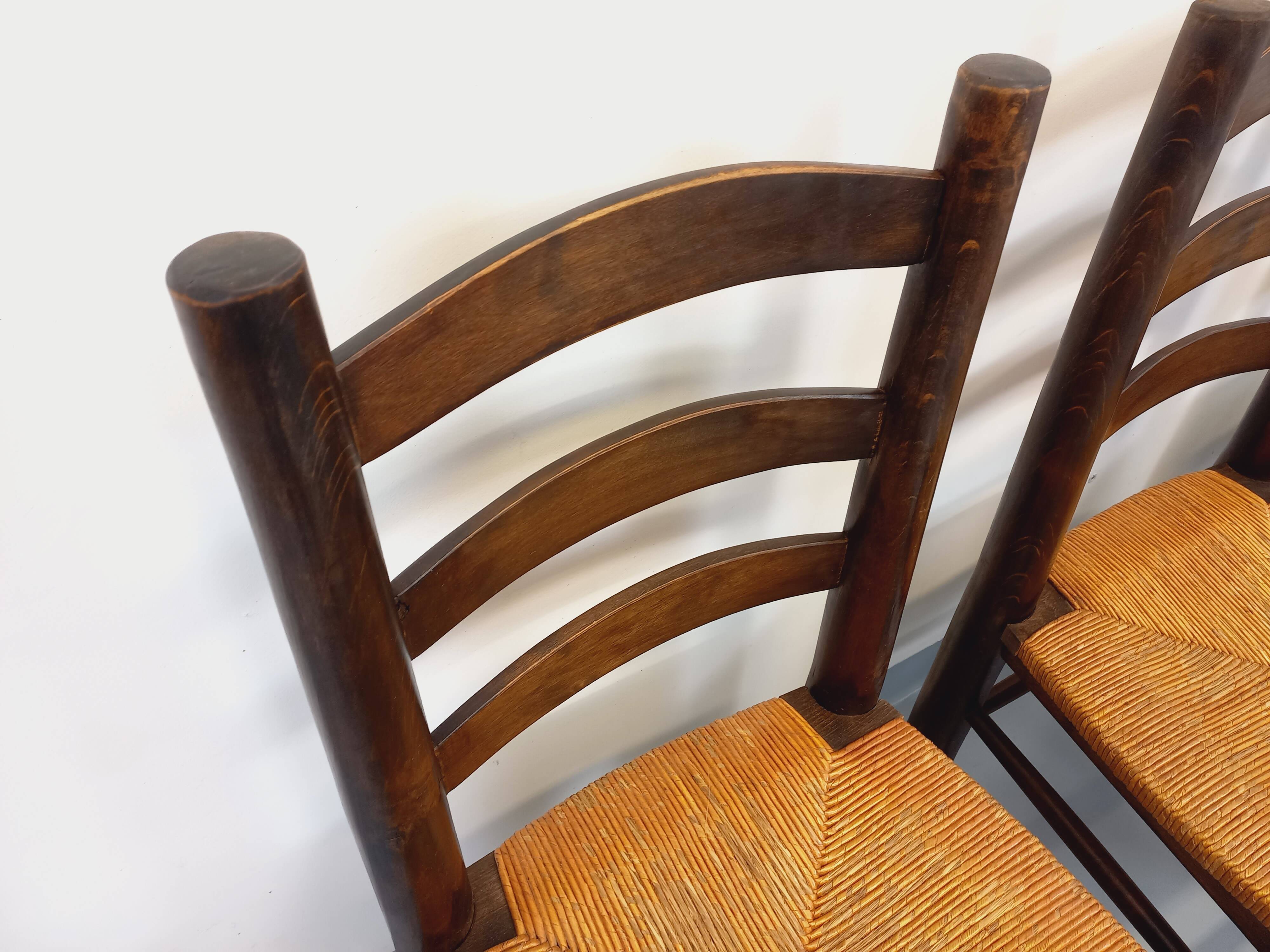 Set of 4 vintage brutalist chairs by Georges Robert in wood and straw.