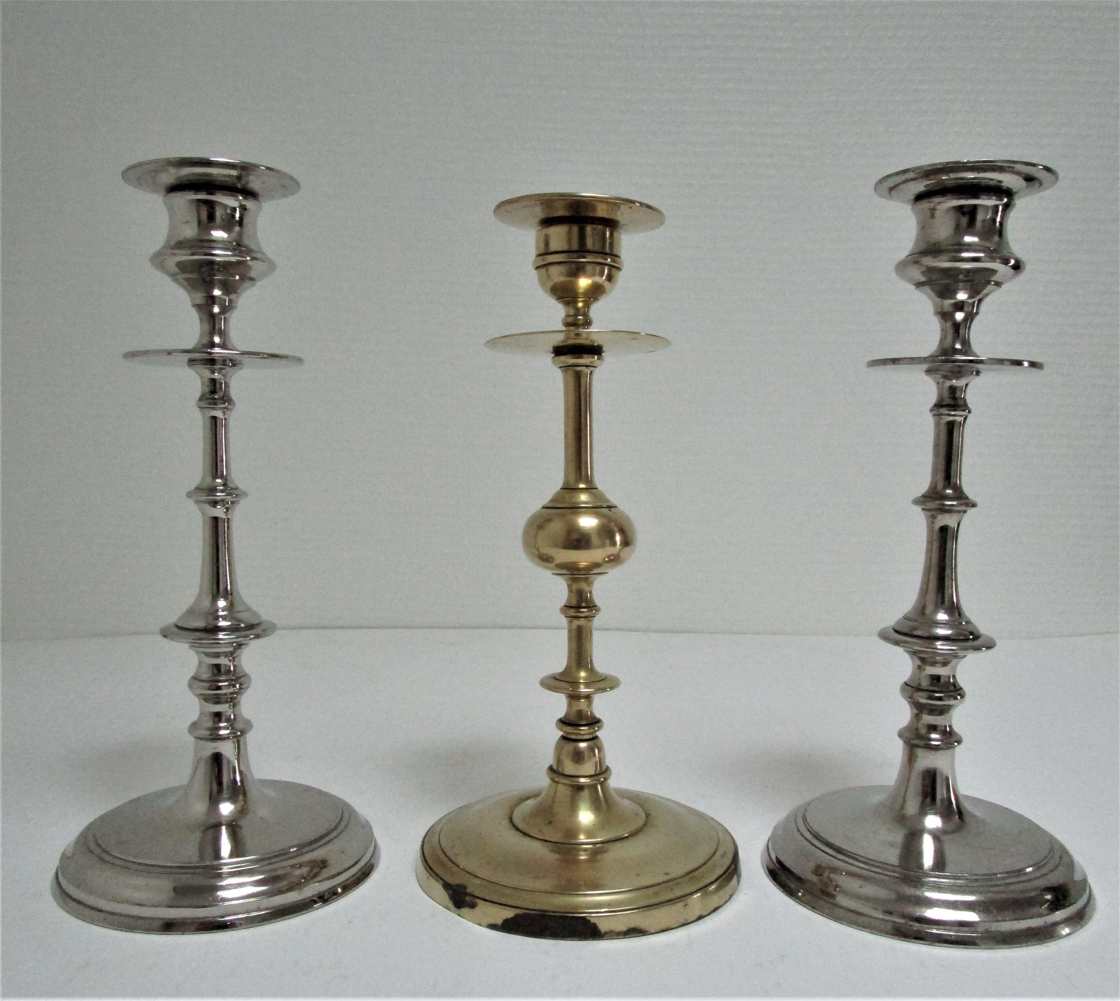 three brass and chrome candle holders early twentieth century