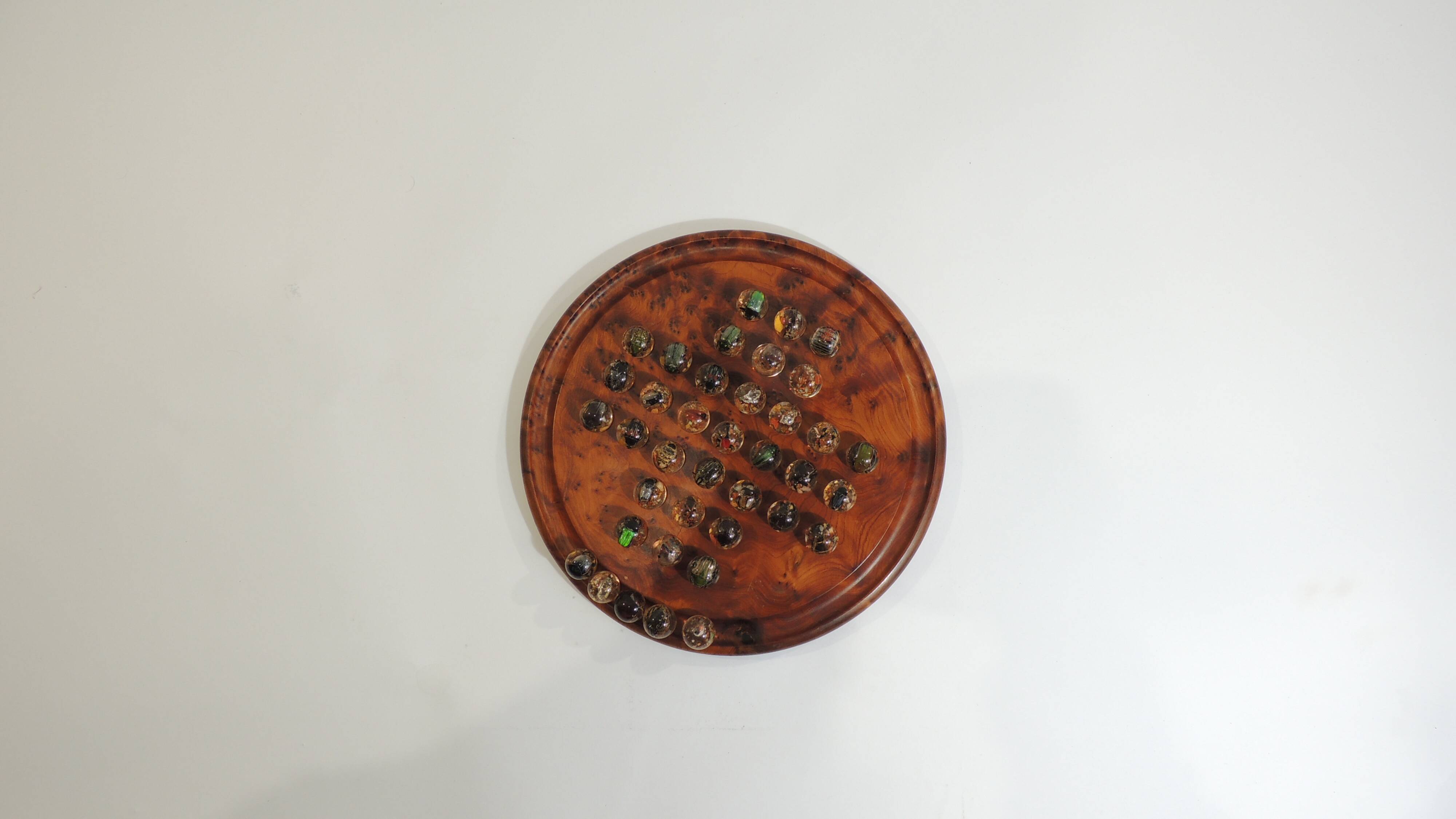 Vintage wooden solitaire game with resin balls and insects – Madaga