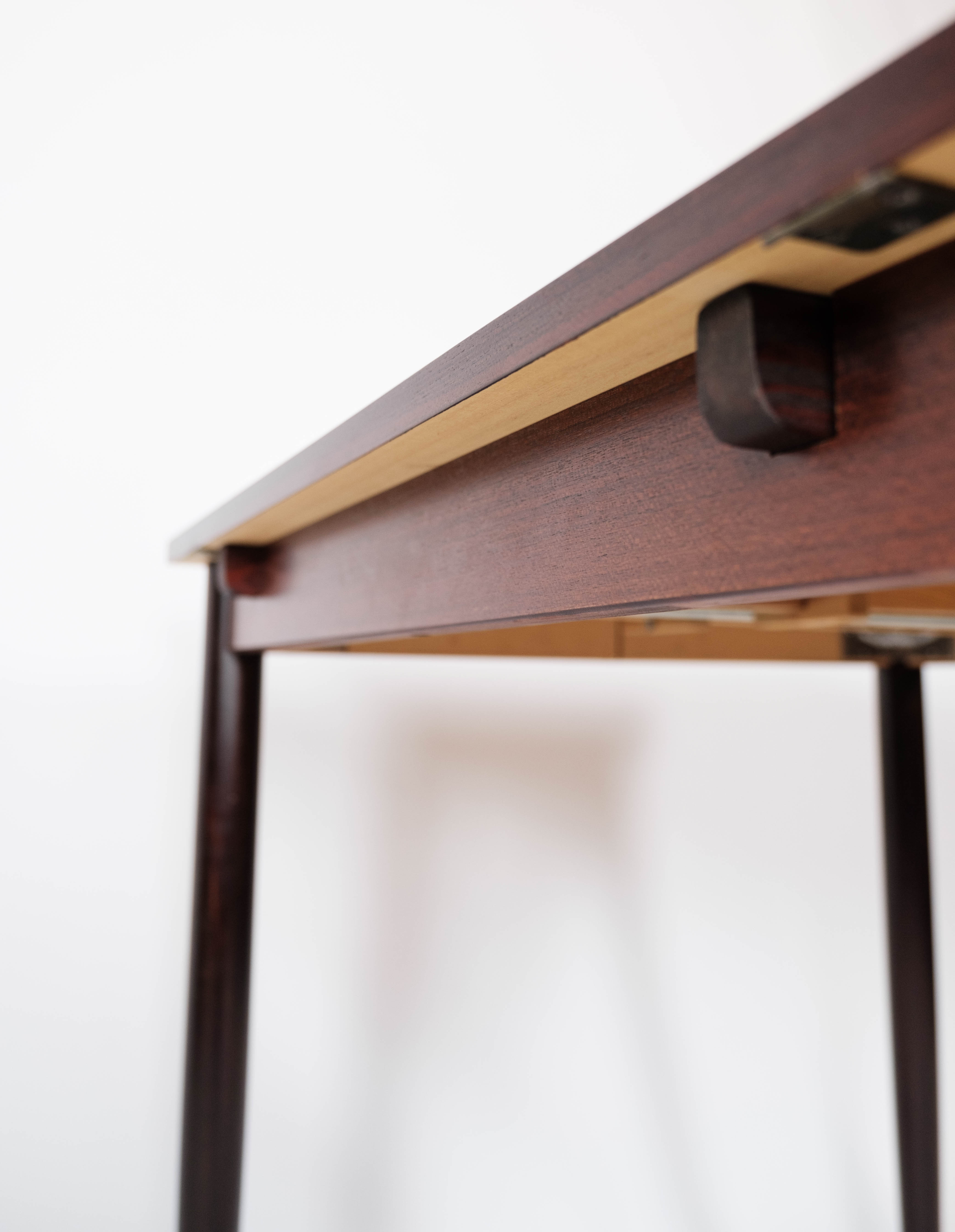 Dining table in rosewood with extension plates, designed by Arne Vodder, 1960s