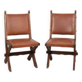 Pair of brutalist style chairs, in wood and leather.