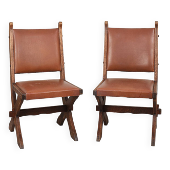 Pair of brutalist style chairs, in wood and leather.