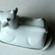 White ceramic butter dish in the shape of a cow, vintage