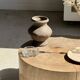 Petrified wood catchall or dish in beige with several grey spots in the centre.