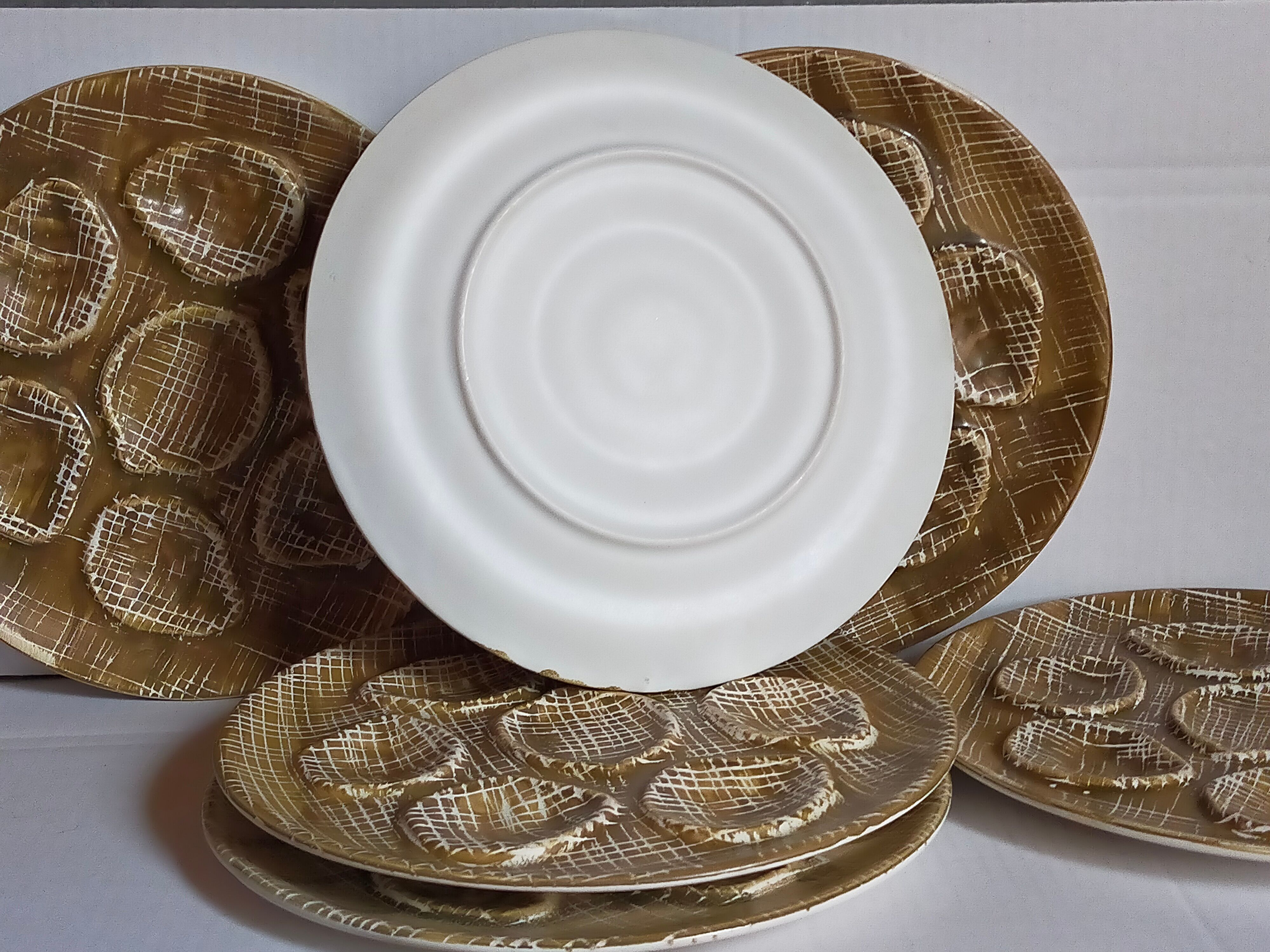 Six oyster plates earthenware with matte enamel, 50s