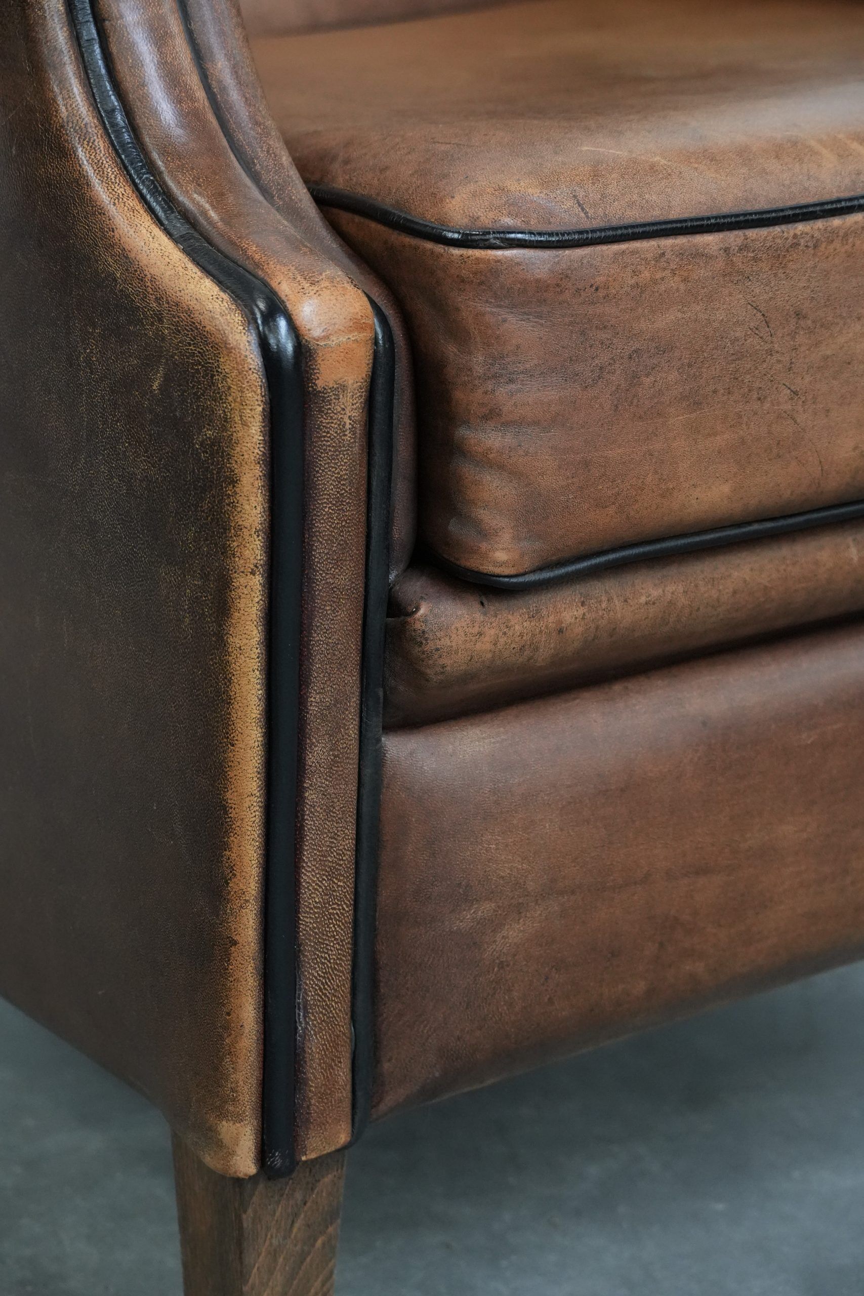 Sheepskin wingback armchair with beautiful colours in good condition