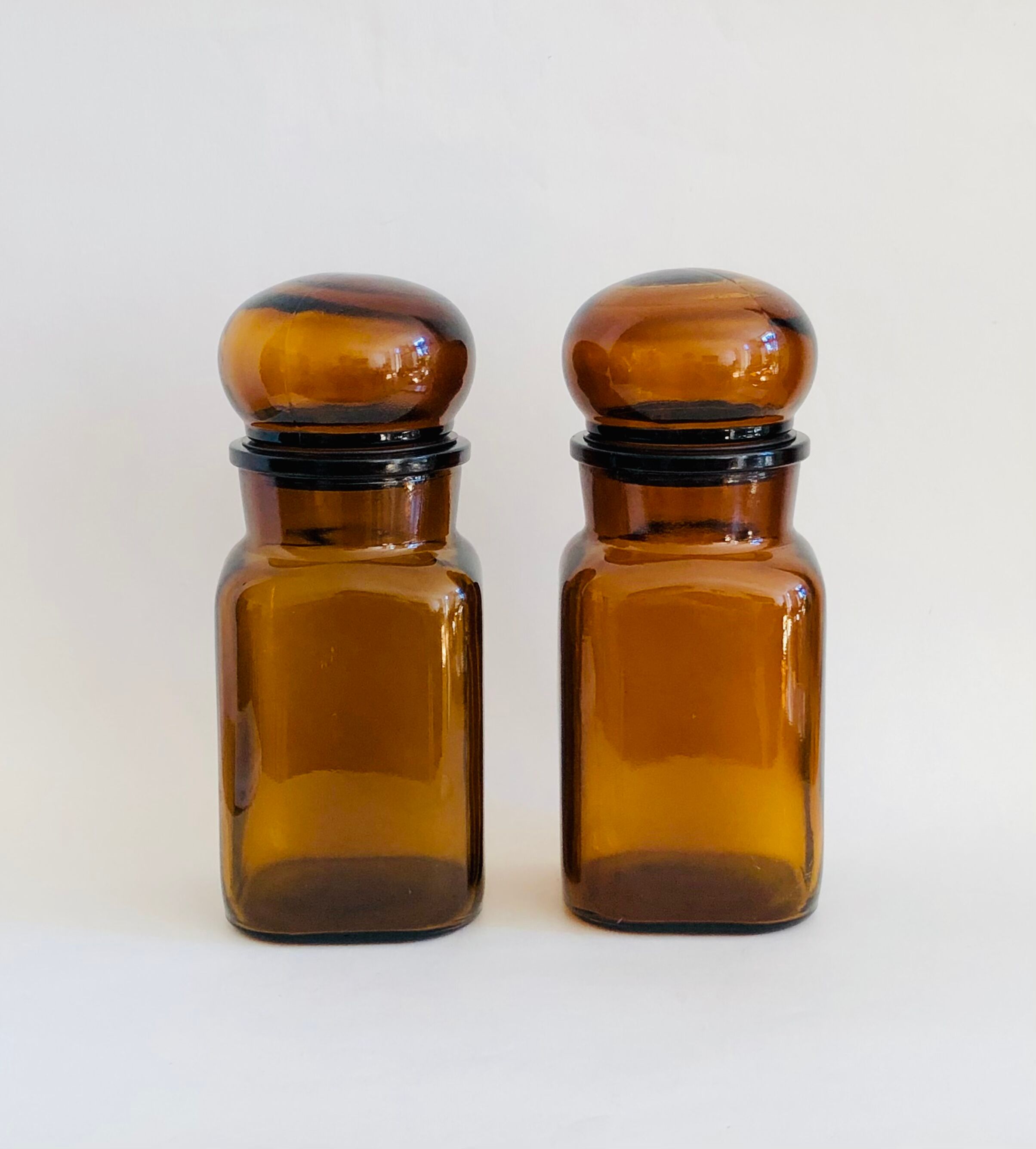 Pair of vintage amber glass jars