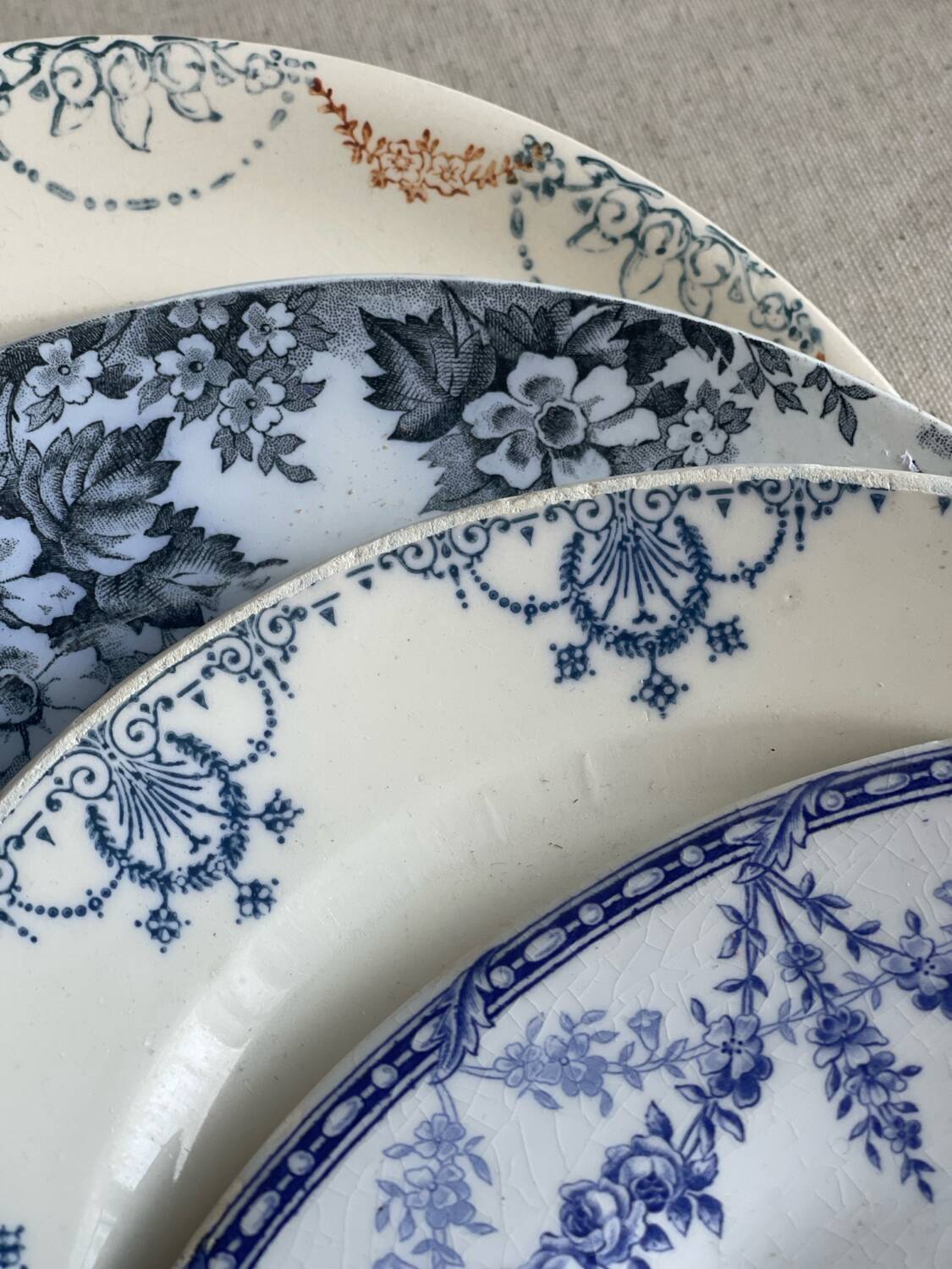 9 mismatched blue ironstone plates