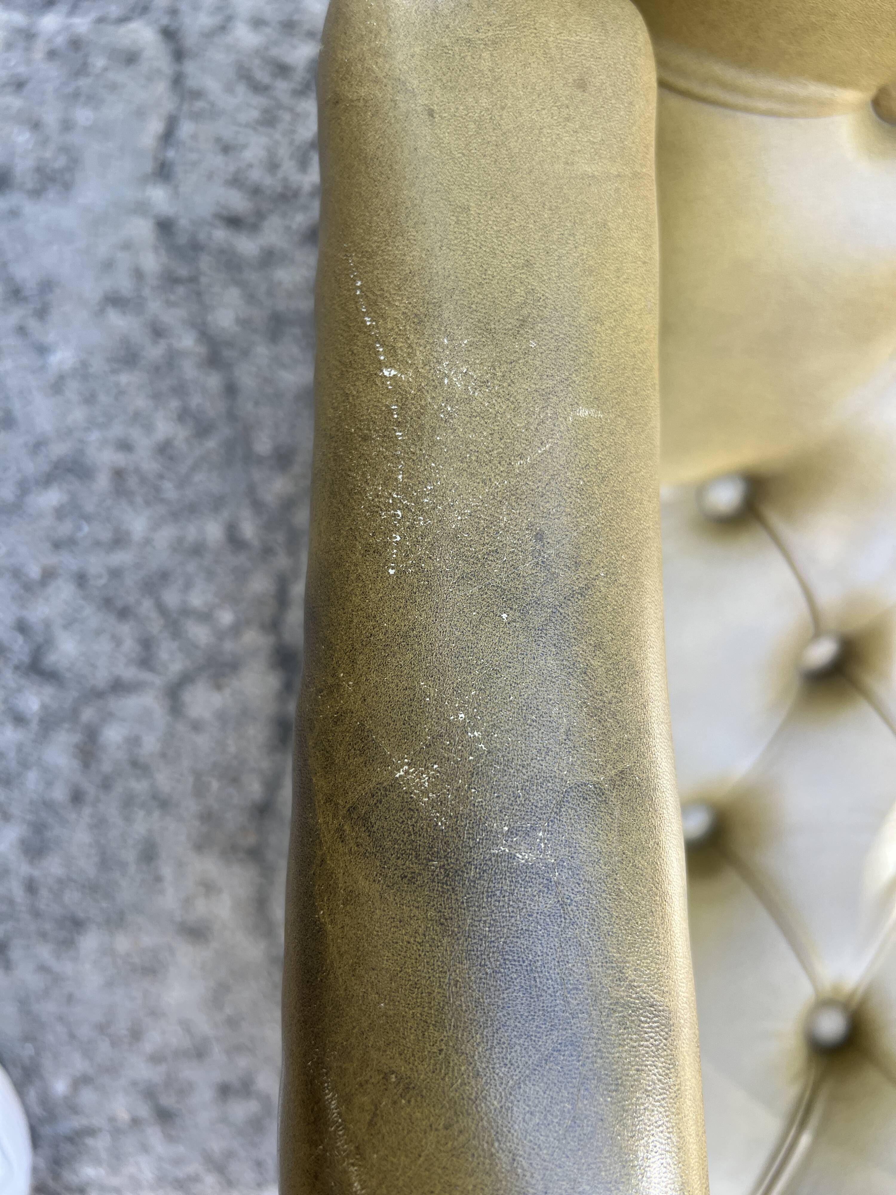 Victoria style green leather chesterfield armchair