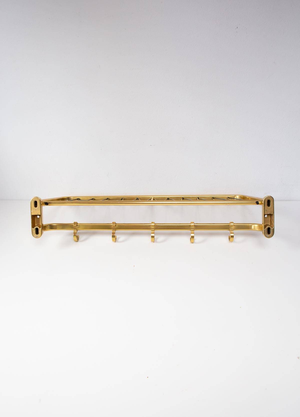 Wall-mounted coat rack with a golden aluminium shelf c. 1960 (62.5 cm)