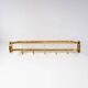 Wall-mounted coat rack with a golden aluminium shelf c. 1960 (62.5 cm)
