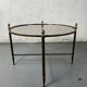 Round coffee table in brass and smoked glass