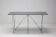 Folding smoked glass dining table Max Sauze - A masterpiece of minimalist design.