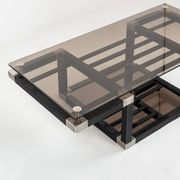 Coffee table attributed to Romeo Rega. Iron and smoked glass – France, 1980s.