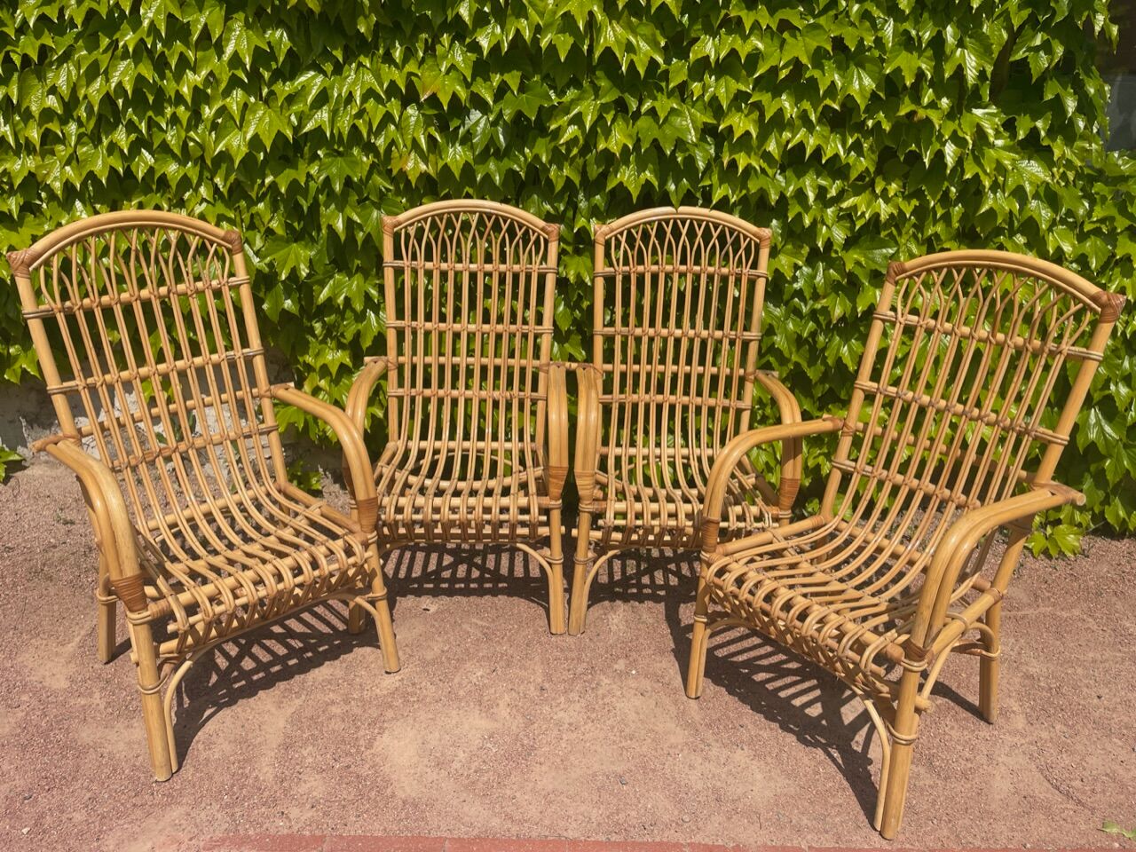 Series of 4 rattan armchairs from the 70s from the Netherlands